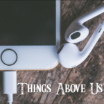 phone, headphones, and Things Above Us logo